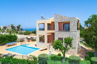 an image of a villa with a swimming pool at Pasiphae villas 1 & 2 in Stalos