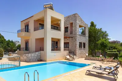 an image of a villa with a swimming pool at Pasiphae villas 1 & 2 in Stalos