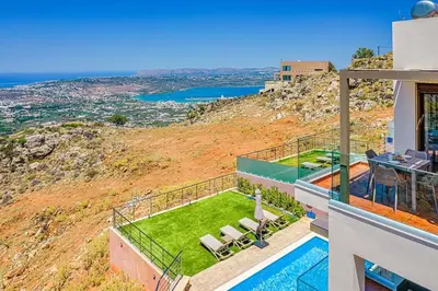 a villa with a view of the ocean at Apartment Lia with private eco pool - Amazing view in Chania Town