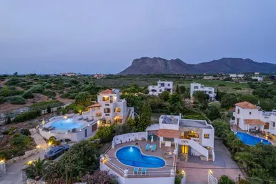 an aerial view of a villa with two swimming pools at Seaview Villa Prima, Sea & Sun Villas in Chorafakia