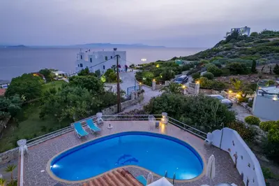 a swimming pool with a view of the ocean at Seaview Villa Prima, Sea & Sun Villas in Chorafakia