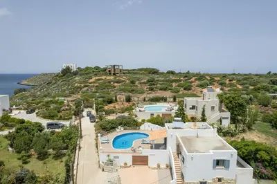 an aerial view of a villa with a swimming pool at Seaview Villa Prima, Sea & Sun Villas in Chorafakia