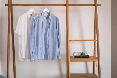 a blue shirt and a white shirt hanging on a shelf at Seaview Villa Ormos, Heated Pool, Sea & Sun Villas in Chorafakia