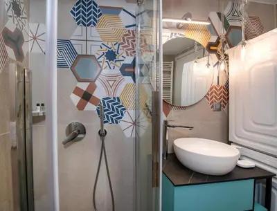 a bathroom with a sink and a mirror at Flos Apartments in Korakiaí