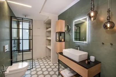 a bathroom with a sink and a toilet at Flos Apartments in Korakiaí