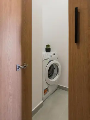 a washing machine with a plant on top of it at Amara Local Experience in Chania Town
