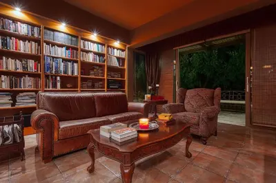 a living room with a couch and a coffee table at Villa Kapodistria in Kallithea-Voukolies