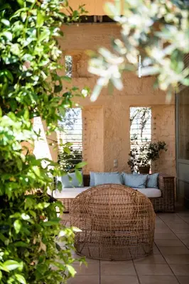 a living room with a couch and a table at Villa Dimi in Kalathas