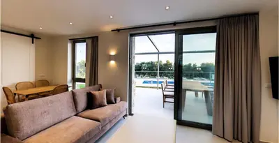 a living room with a couch and a table at Mitos Villas in Gerani Chanion