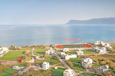 an aerial view of a resort by the water at Magedico 150m from the beach in Kissamos