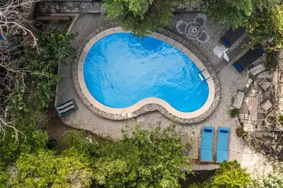 an overhead view of a large swimming pool at Seafalios Villa in Chania Town