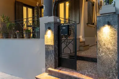 a door to a building with a sign on it at Seafalios Villa in Chania Town