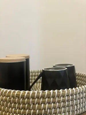 a table with two chairs and two drums at AIOLOS Chania center luxury apartment near the garden in Chania Town