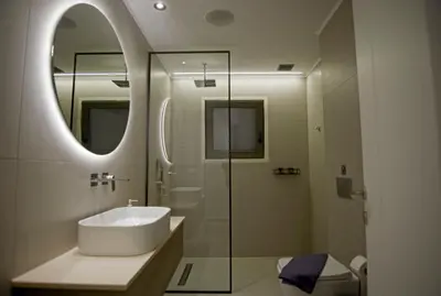 a bathroom with a sink and a mirror at Villa Mourelo luxury villa in chania with private pool jacuzzi in Chania Town