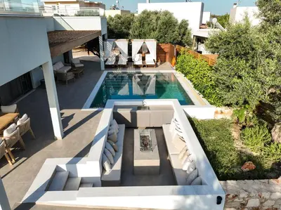 an aerial view of a house with a swimming pool at Villa Mourelo luxury villa in chania with private pool jacuzzi in Chania Town