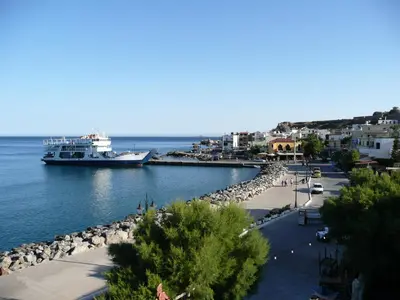 a large boat is docked at a harbor at Corali Studios in Palaiochóra