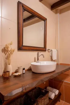 a bathroom with a sink and a mirror at Anemole Traditional Cretan Villa in Megála Khoráfia
