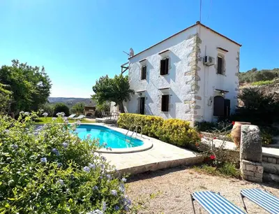 an external view of a house with a swimming pool at Villa Ovgoro, Provarma, pool, seaview balcony in Próvarma