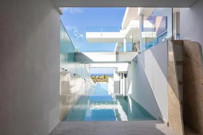 an external view of a building with a swimming pool at Villa St John - Wellness & Entertainment by etouri in Chania Town