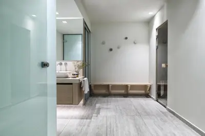 a bathroom with a sink and a mirror at Villa St John - Wellness & Entertainment by etouri in Chania Town