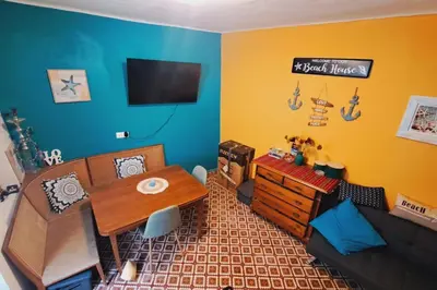 a living room with a table and a couch at Beautiful house in the old town of Chania- 4 rooms in Chania Town