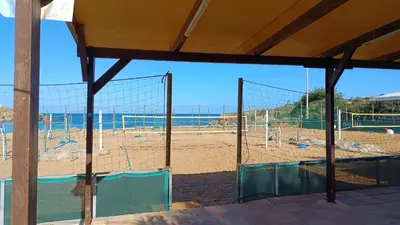 a gym with a volley ball court on the beach at Villa Ammos in Daratso