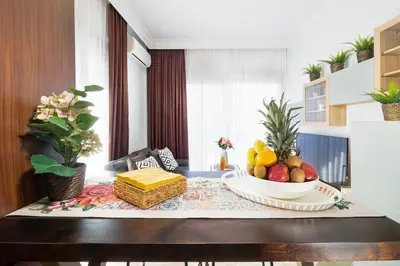 a table with a bowl of fruit on top of it at Home Philip III in Chania Town