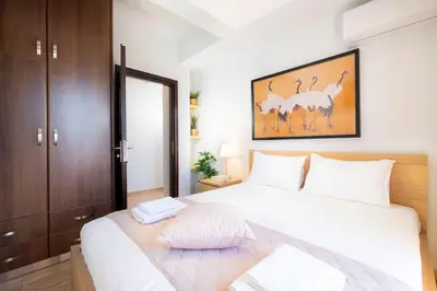 a bedroom with a large white bed with white pillows at Home Philip III in Chania Town