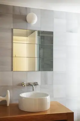 a bathroom with a sink and a mirror at Elorhouse in the charming neighborhood of KoumKapi in Chania Town