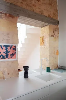 a kitchen with a sink and a staircase at Elorhouse in the charming neighborhood of KoumKapi in Chania Town
