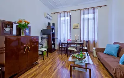 a living room with a couch and a table at Aphrodite House in Chania Town