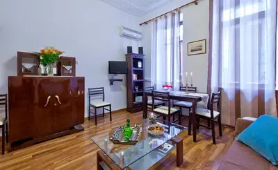 a living room with a couch and a table at Aphrodite House in Chania Town