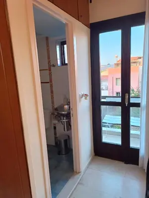 a door leading to a room with a balcony at Rayon De Soleil in Chania Town