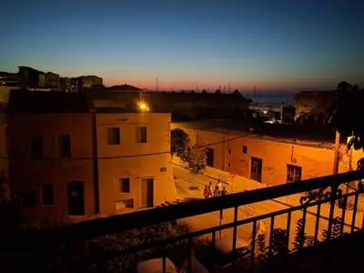 a view of a city at sunset from a building at Rayon De Soleil in Chania Town
