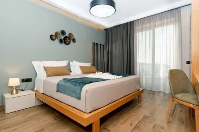 a bedroom with a large bed and a window at Exquisite Crete Villa Villa Kleanthi 4 Bedroom Private Pool in Stalos