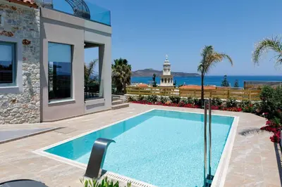a swimming pool in front of a house at Exquisite Crete Villa Villa Kleanthi 4 Bedroom Private Pool in Stalos