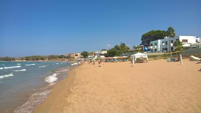 a beach with a bunch of people on it at Zinovia in Kato Daratso