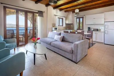 a living room with a couch and a table at Villa Forteza in Kalami