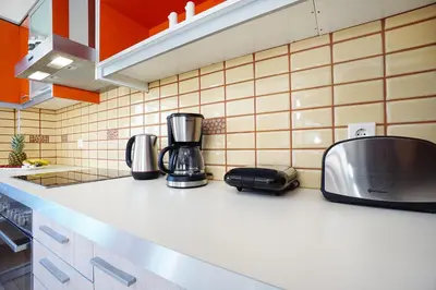 a kitchen counter with a coffee maker on it at Geas House Ammos in Kolymvari
