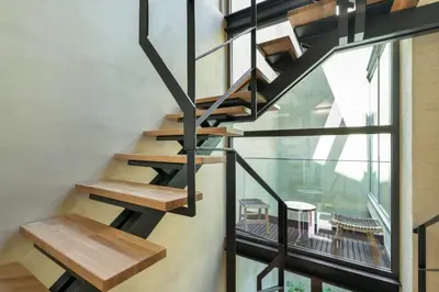 a staircase in a house with a window at Poem Suites in Chania Town