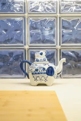 a blue and white tea pot sitting on a table at Aeri Home - At Nea Chora beach w. Parking included in Chania Town