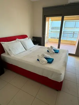 a bedroom with a bed with towels on it at Seaty Luxury apartment in Chania Town