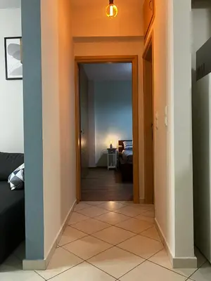 a hallway with a door leading to a bedroom at Stephanie's Place - Charming Apartment with Sea View in Chania Town