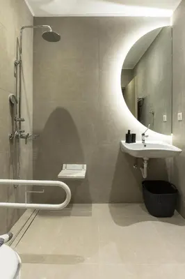 a bathroom with a sink and a shower with a mirror at Cove Elafonisi Apartments in Elafonisi
