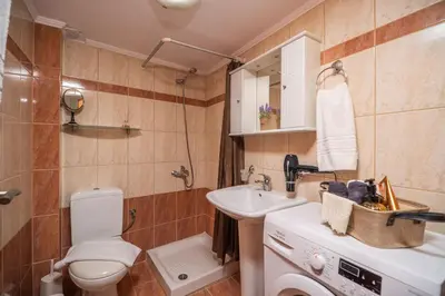 a small bathroom with a toilet and a sink at Ammoutsiani 2 Cozy Apartment by 8essentially in Chania Town