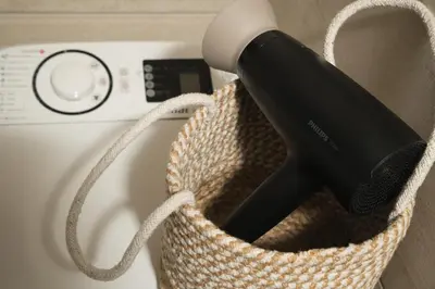 a hair dryer in a basket next to a microwave at ModernPastel Studio-Near Old Port in Chania Town