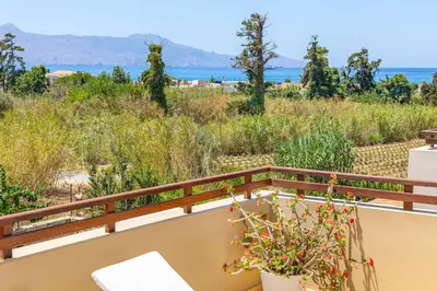a balcony with a view of the ocean at Villa Portokalia Platanias in Plataniás