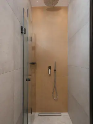 a shower with a glass door in a bathroom at Mimosa Minaret Jacuzzi Old Town Chania in Chania Town