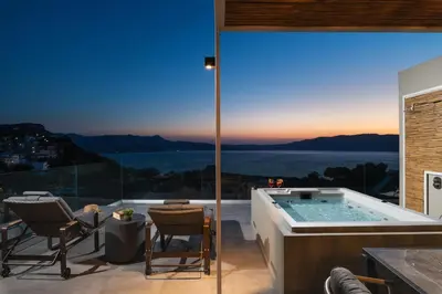 a jacuzzi tub in a house with a view at Raviewha Luxury Apartments in Ravdhoúkha