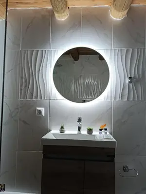 a bathroom with a sink and a mirror at Villa Lina private pool in Kondomari
